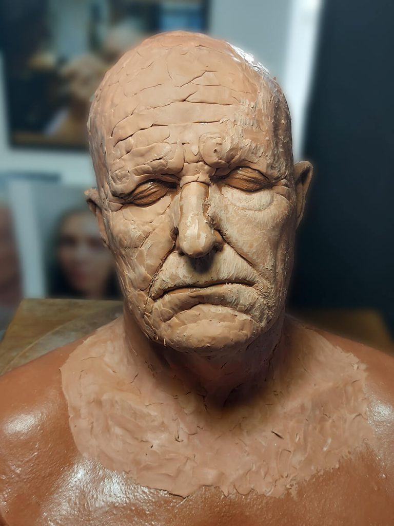 Painkiller - Initial application of clay building up forms and the planes of the face.
