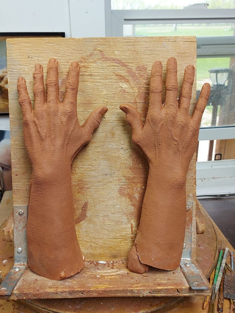 Hand sculpture of the Fifth Floor Elevator Lady.